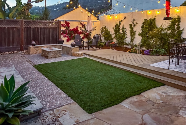 910 N Nopal St, Santa Barbara, CA 93103 - view of yard featuring a fire pit, a wooden deck, and a patio area