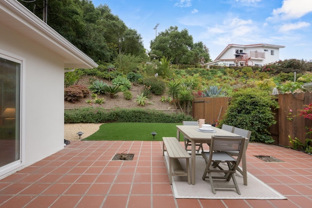 view of patio / terrace featuring fence and outdoor dining space