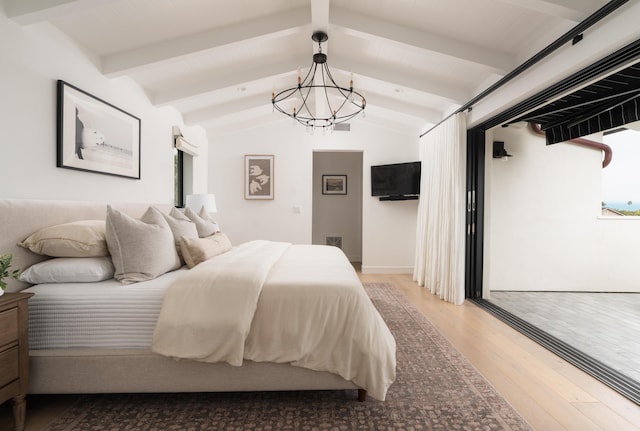 bedroom with wood finished floors, visible vents, a notable chandelier, access to outside, and vaulted ceiling with beams