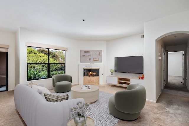 4643 Gerona Way, Santa Barbara, CA 93110 - carpeted living room featuring arched walkways and a glass covered fireplace
