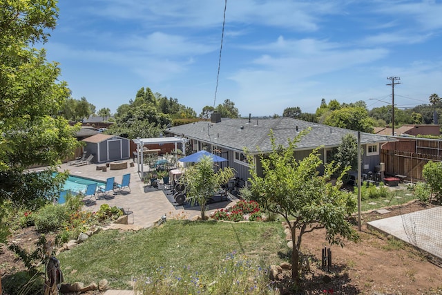 3933 Foothill Rd, Santa Barbara, CA 93110 - rear view of house with a patio, a fenced backyard, an outdoor pool, and roof with shingles