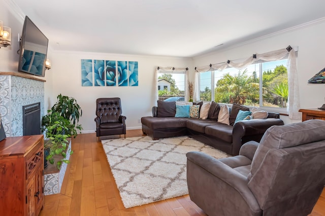 3933 Foothill Rd, Santa Barbara, CA 93110 - living area featuring ornamental molding, hardwood / wood-style floors, plenty of natural light, and a tiled fireplace
