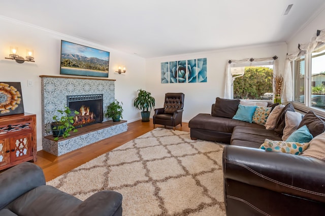 3933 Foothill Rd, Santa Barbara, CA 93110 - living area with crown molding, wood finished floors, a fireplace, and baseboards