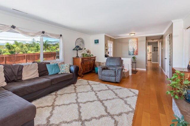 3933 Foothill Rd, Santa Barbara, CA 93110 - living room with hardwood / wood-style flooring, ornamental molding, and baseboards