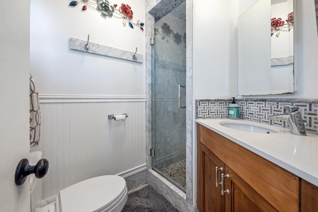 3933 Foothill Rd, Santa Barbara, CA 93110 - full bathroom featuring vanity, a shower stall, toilet, wainscoting, and tile patterned floors