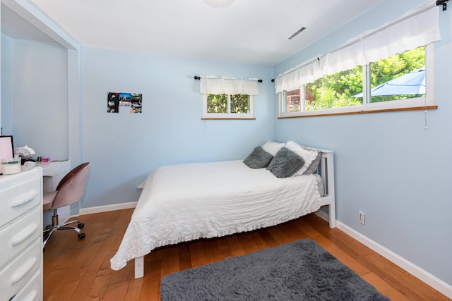 3933 Foothill Rd, Santa Barbara, CA 93110 - bedroom with hardwood / wood-style floors and baseboards
