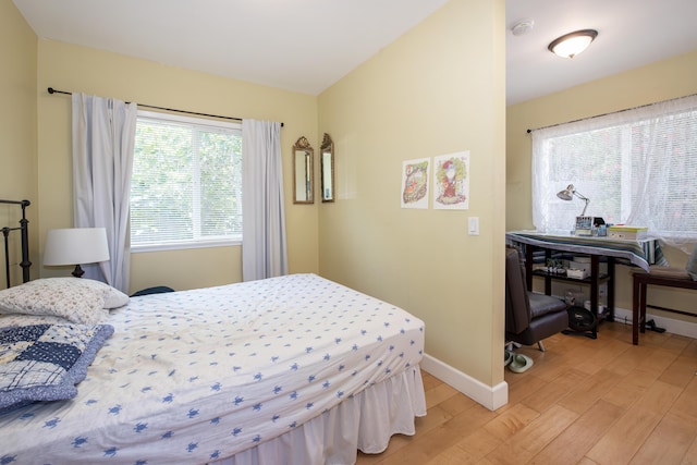 3933 Foothill Rd, Santa Barbara, CA 93110 - bedroom with light wood-style flooring, baseboards, and multiple windows