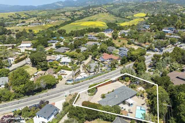 3933 Foothill Rd, Santa Barbara, CA 93110 - aerial overview of property's location with property parcel outlined, nearby suburban area, a mountainous background, and a pool