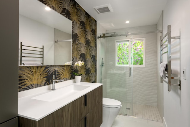 415 Yankee Farm Rd, Santa Barbara, CA 93109 - full bathroom with a towel warming rack, vanity, radiator heating unit, a shower stall, and toilet