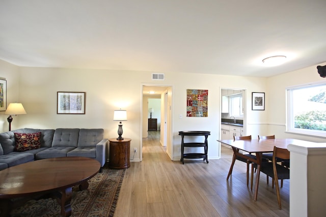 living room featuring wood finished floors and baseboards