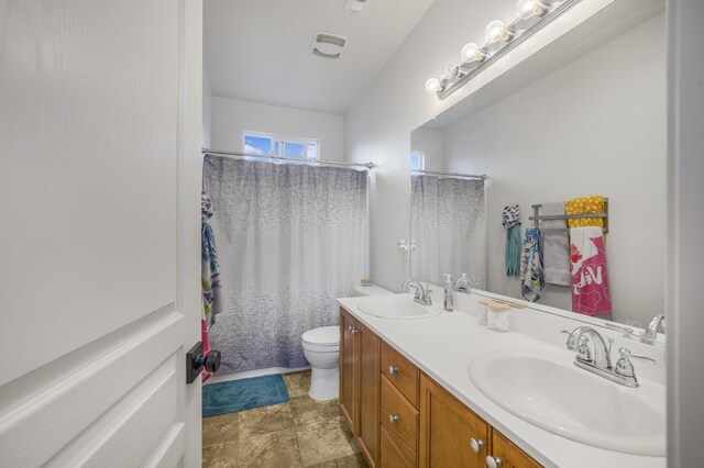 1010 Tranquillion Ct, Lompoc, CA 93436 - bathroom with double vanity, toilet, and a shower with curtain