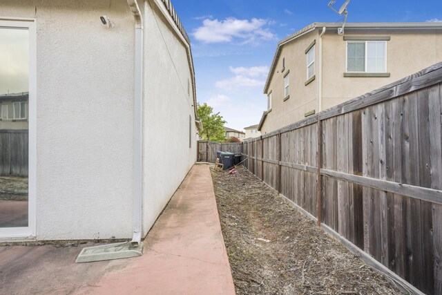 1010 Tranquillion Ct, Lompoc, CA 93436 - view of property exterior featuring stucco siding, a fenced backyard, and central AC unit