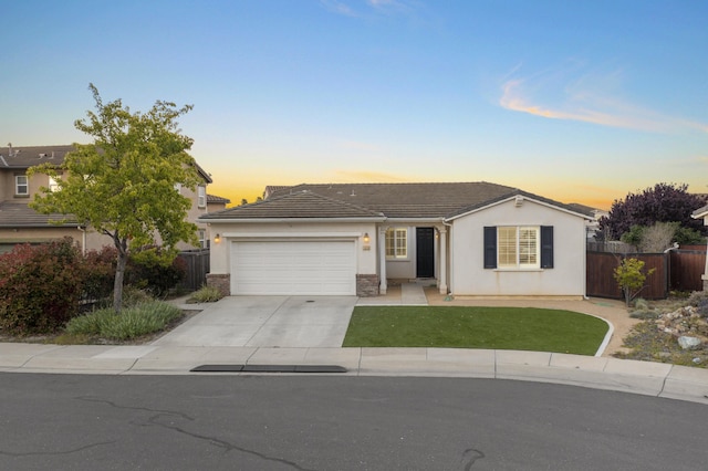 1010 Tranquillion Ct, Lompoc, CA 93436 - ranch-style home featuring a garage, concrete driveway, stucco siding, and a tile roof