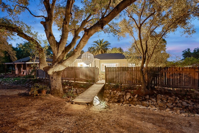 view of yard at dusk