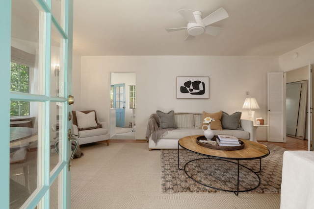 living area featuring ceiling fan