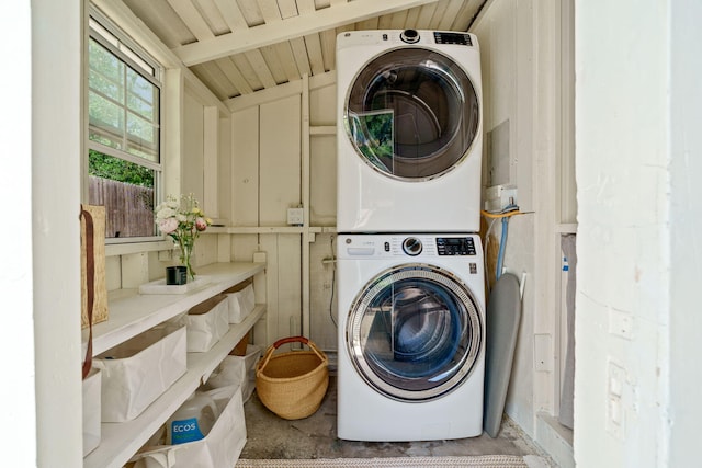 laundry area with stacked washer and clothes dryer