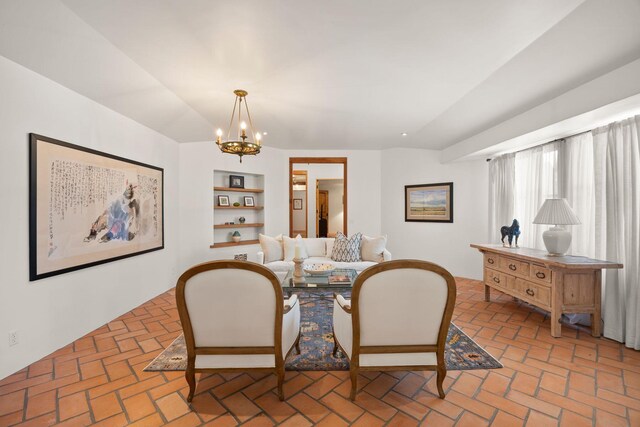 10971 Alto Ct, Oak View, CA 93022 - dining space featuring brick flooring, a chandelier, built in features, and vaulted ceiling