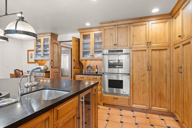 10971 Alto Ct, Oak View, CA 93022 - kitchen with stainless steel double oven, a sink, dark countertops, wine cooler, and recessed lighting