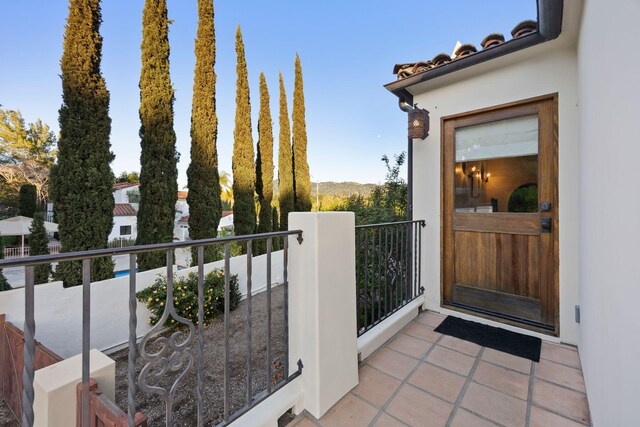 10971 Alto Ct, Oak View, CA 93022 - view of exterior entry featuring a balcony, stucco siding, and a tile roof