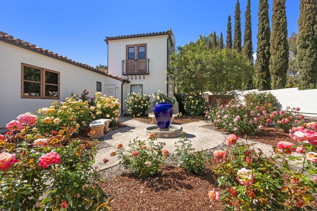 10971 Alto Ct, Oak View, CA 93022 - rear view of property featuring fence, stucco siding, a balcony, and a tiled roof