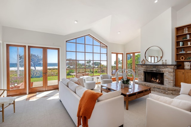 5529 Calle Arena, Carpinteria, CA 93013 - living room featuring carpet flooring, lofted ceiling, a brick fireplace, french doors, and recessed lighting