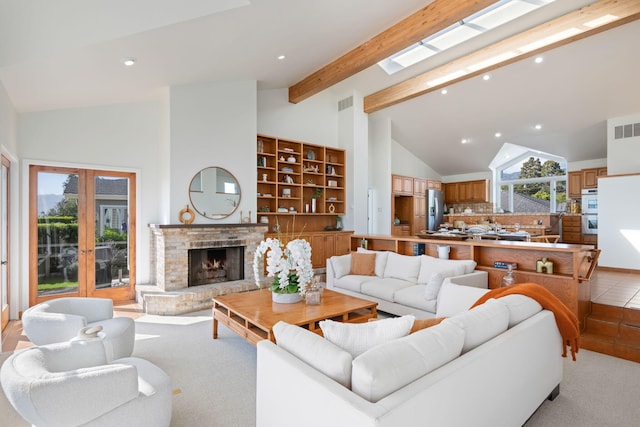 5529 Calle Arena, Carpinteria, CA 93013 - living room featuring recessed lighting, high vaulted ceiling, beamed ceiling, french doors, and a fireplace