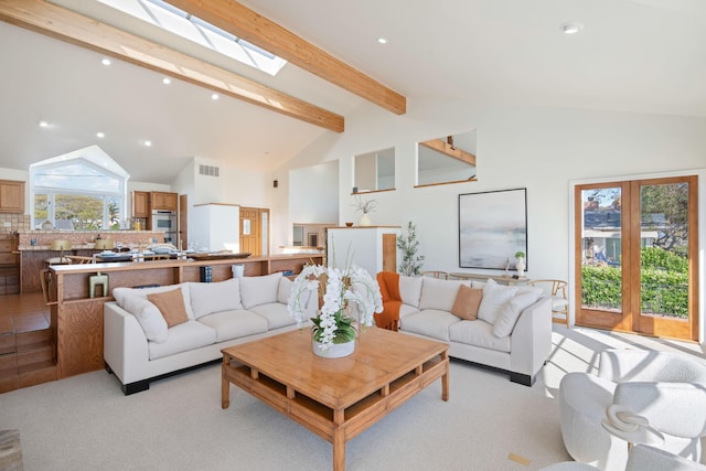 5529 Calle Arena, Carpinteria, CA 93013 - living area featuring beam ceiling, high vaulted ceiling, recessed lighting, a skylight, and light carpet