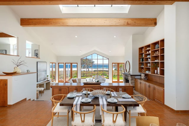 5529 Calle Arena, Carpinteria, CA 93013 - dining space with light tile patterned floors, a skylight, recessed lighting, and baseboards