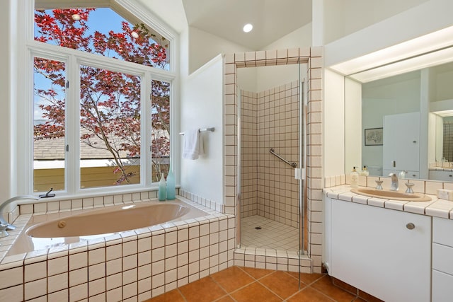 5529 Calle Arena, Carpinteria, CA 93013 - full bath featuring vanity, a garden tub, a shower stall, tile patterned floors, and lofted ceiling