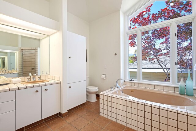 5529 Calle Arena, Carpinteria, CA 93013 - full bath with vanity, a bath, toilet, and tile patterned flooring