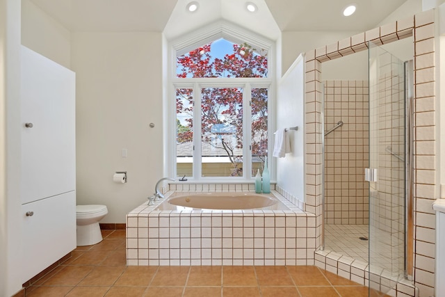 5529 Calle Arena, Carpinteria, CA 93013 - bathroom featuring vaulted ceiling, a bath, tile patterned floors, a shower stall, and toilet