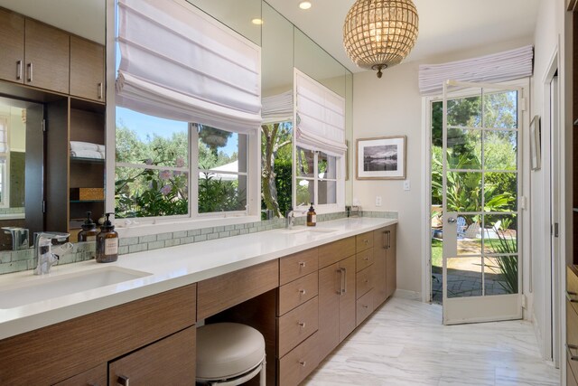 7200 Casitas Pass Rd, Carpinteria, CA 93103 - bathroom with marble finish floors, double vanity, and a chandelier