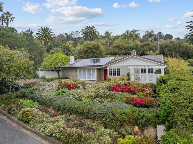 919 Aleeda Ln, Santa Barbara, CA 93108 - view of front of property with french doors, roof mounted solar panels, and a chimney