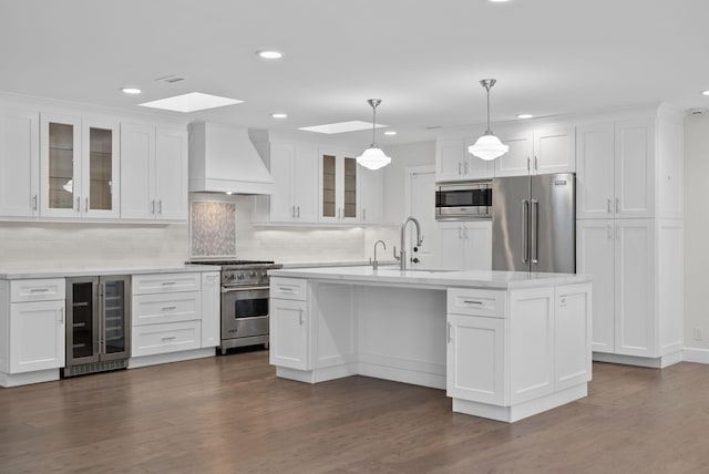 919 Aleeda Ln, Santa Barbara, CA 93108 - kitchen featuring premium range hood, premium appliances, beverage cooler, a sink, and recessed lighting