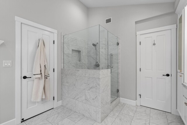 919 Aleeda Ln, Santa Barbara, CA 93108 - bathroom featuring baseboards, a shower stall, and marble look tiles