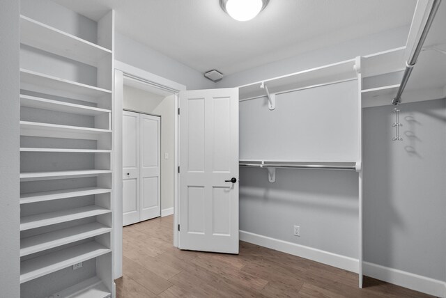 919 Aleeda Ln, Santa Barbara, CA 93108 - walk in closet with wood finished floors