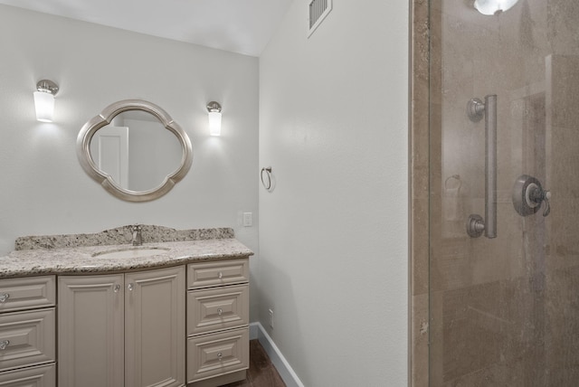 919 Aleeda Ln, Santa Barbara, CA 93108 - full bathroom featuring a stall shower, vanity, baseboards, and wood finished floors