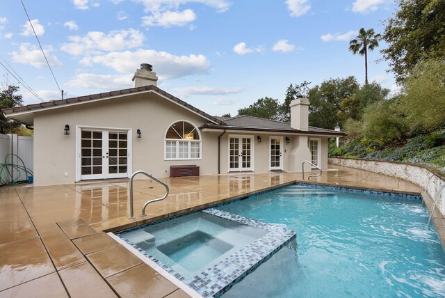 919 Aleeda Ln, Santa Barbara, CA 93108 - back of property featuring french doors, a chimney, a patio, and stucco siding