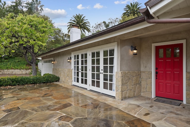 919 Aleeda Ln, Santa Barbara, CA 93108 - doorway to property featuring stone siding, french doors, and stucco siding