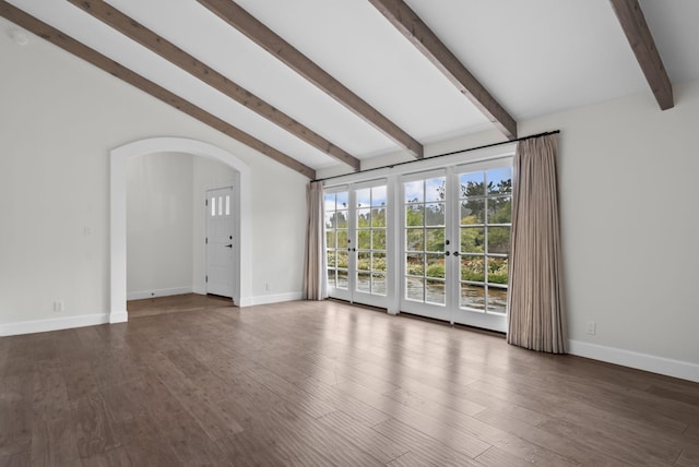 919 Aleeda Ln, Santa Barbara, CA 93108 - unfurnished living room featuring arched walkways, baseboards, dark wood-type flooring, and french doors