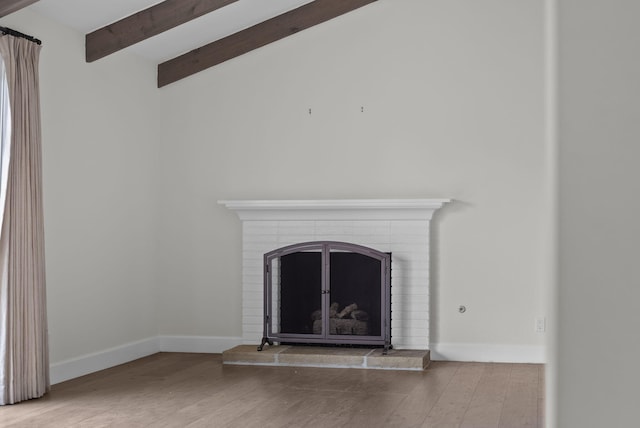 919 Aleeda Ln, Santa Barbara, CA 93108 - detailed view of beam ceiling, wood finished floors, a brick fireplace, and baseboards