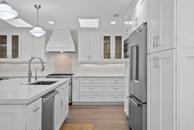 919 Aleeda Ln, Santa Barbara, CA 93108 - kitchen featuring high quality appliances, premium range hood, a sink, recessed lighting, and white cabinetry