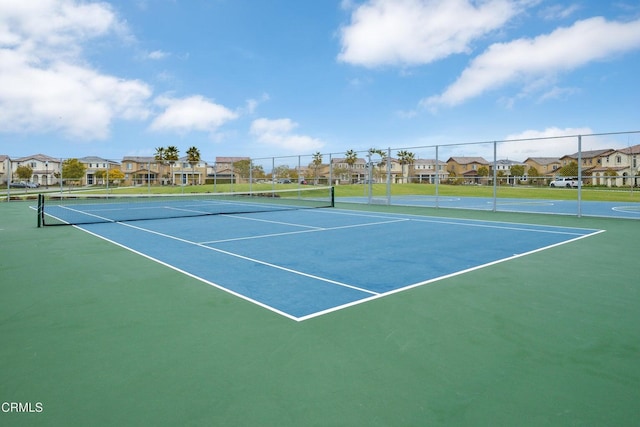 714 Nile River Dr, Oxnard, CA 93036 - view of tennis court with fence, a residential view, and community basketball court