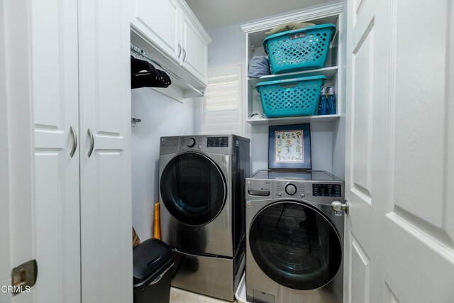 714 Nile River Dr, Oxnard, CA 93036 - laundry room with washing machine and clothes dryer and cabinet space