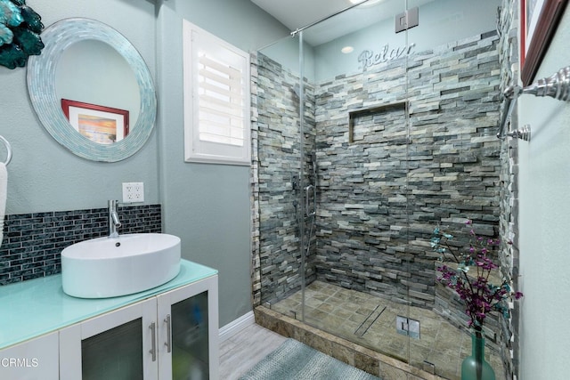 714 Nile River Dr, Oxnard, CA 93036 - full bath featuring tasteful backsplash, a stall shower, vanity, and wood finished floors
