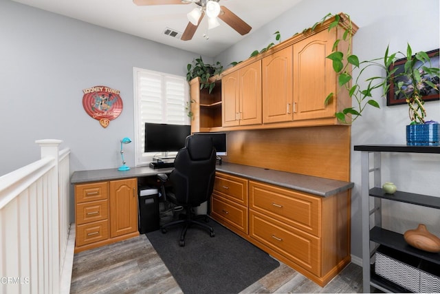 714 Nile River Dr, Oxnard, CA 93036 - office featuring built in study area, a ceiling fan, and dark wood-type flooring