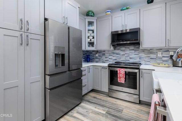 714 Nile River Dr, Oxnard, CA 93036 - kitchen with appliances with stainless steel finishes, light countertops, and backsplash