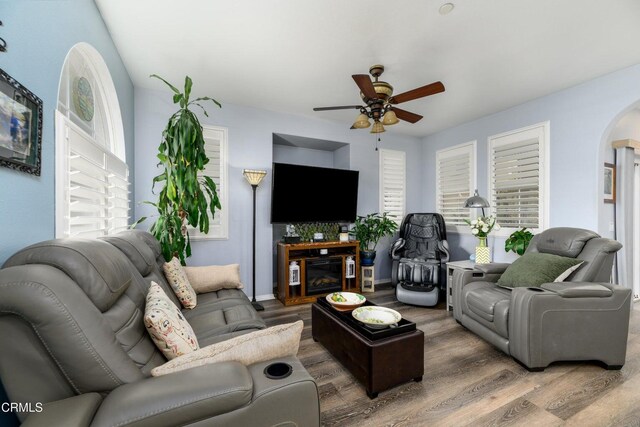 714 Nile River Dr, Oxnard, CA 93036 - living area with a ceiling fan, arched walkways, and wood finished floors