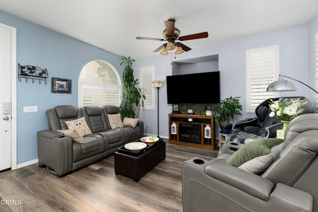 714 Nile River Dr, Oxnard, CA 93036 - living room with a ceiling fan, wood finished floors, baseboards, and a fireplace