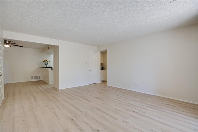 232 Rosewood St, Ventura, CA 93001 - spare room featuring light wood-type flooring, a textured ceiling, ceiling fan, and baseboards